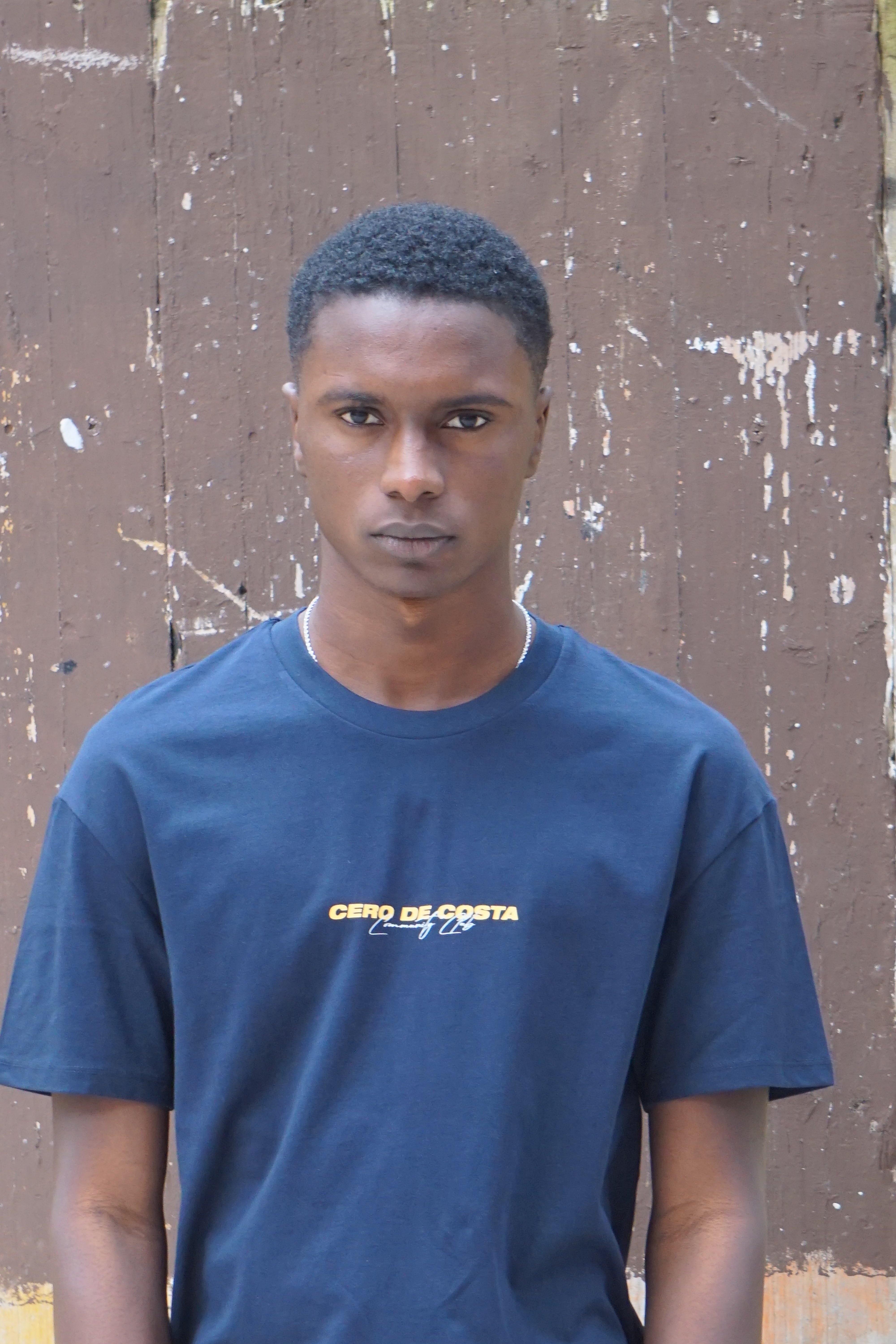CAMISETA MARINO/NARANJA-BLANCO "CERO DE COSTA" PLAYAS SURF